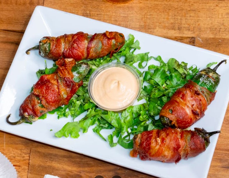 Bacon-wrapped peppers served at Maya